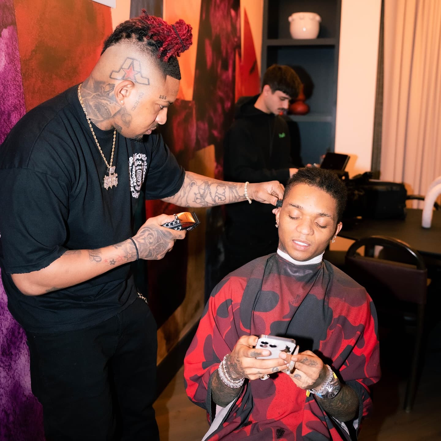 Sco Brazy cutting hair in the shop