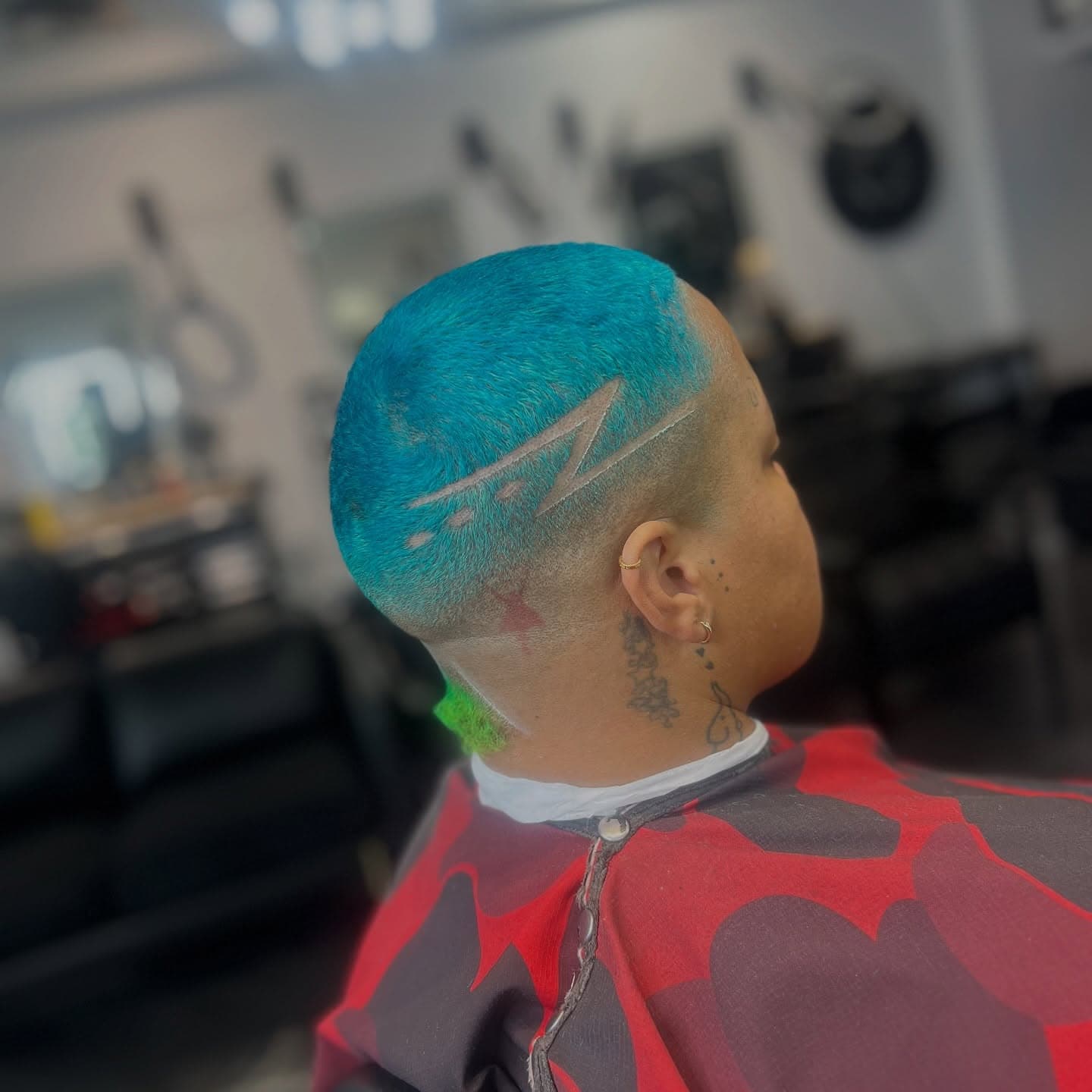 Creative teal and green color work with shaved patterns